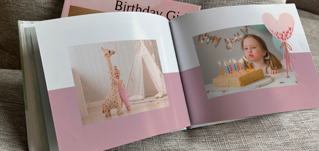 Woman holding an open photobook showing photos of friends celebrating the 4th of July.