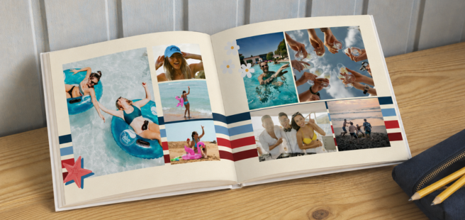 Woman holding an open photobook showing photos of friends celebrating the 4th of July.