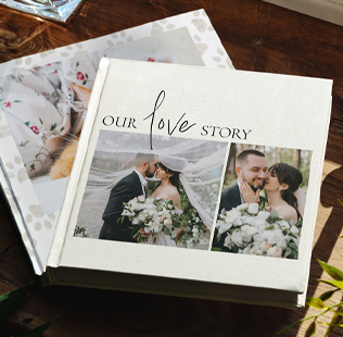Open book showing photos of mom, dad and daughter outside.