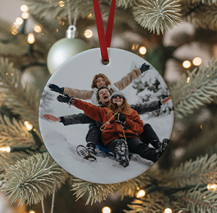 Closed calendar leaned against the wall showing photo of mom and daughter that reads 'Ava & Mom 2024'.