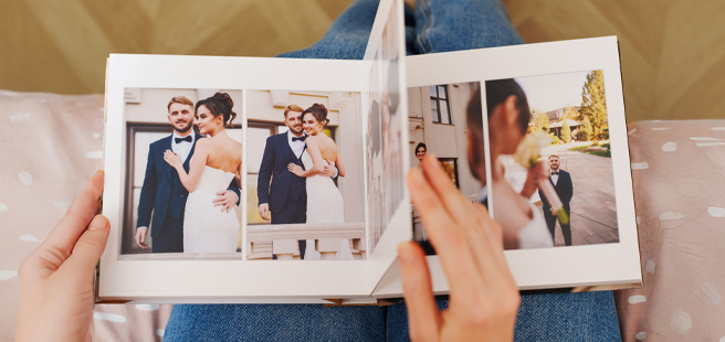 Closed photobook showing photos of a son and father on the cover that reads 'my dad is my superhero'.