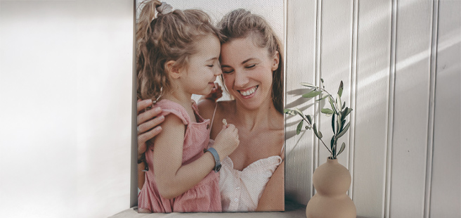 Closed photobook showing photos of a son and father on the cover that reads 'my dad is my superhero'.
