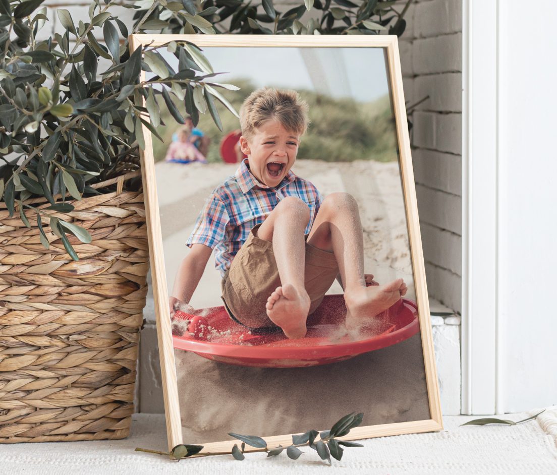 Mini photobook of two women with an American flag that says 'Sunny Days', Canvas print of three children sitting down holding mini American flags