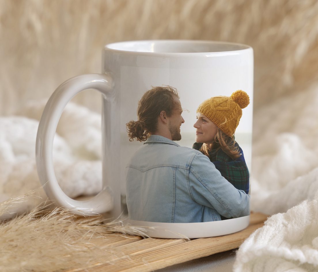 Photo Gifts Canvas print of couple hugging with a surfbaord, a white mug with 'World's Best Dog' text and a picture of a person with a dog, half of a photobook of two women hugging