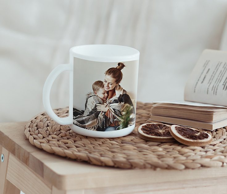Photo Gifts Canvas print of couple hugging with a surfbaord, a white mug with 'World's Best Dog' text and a picture of a person with a dog, half of a photobook of two women hugging