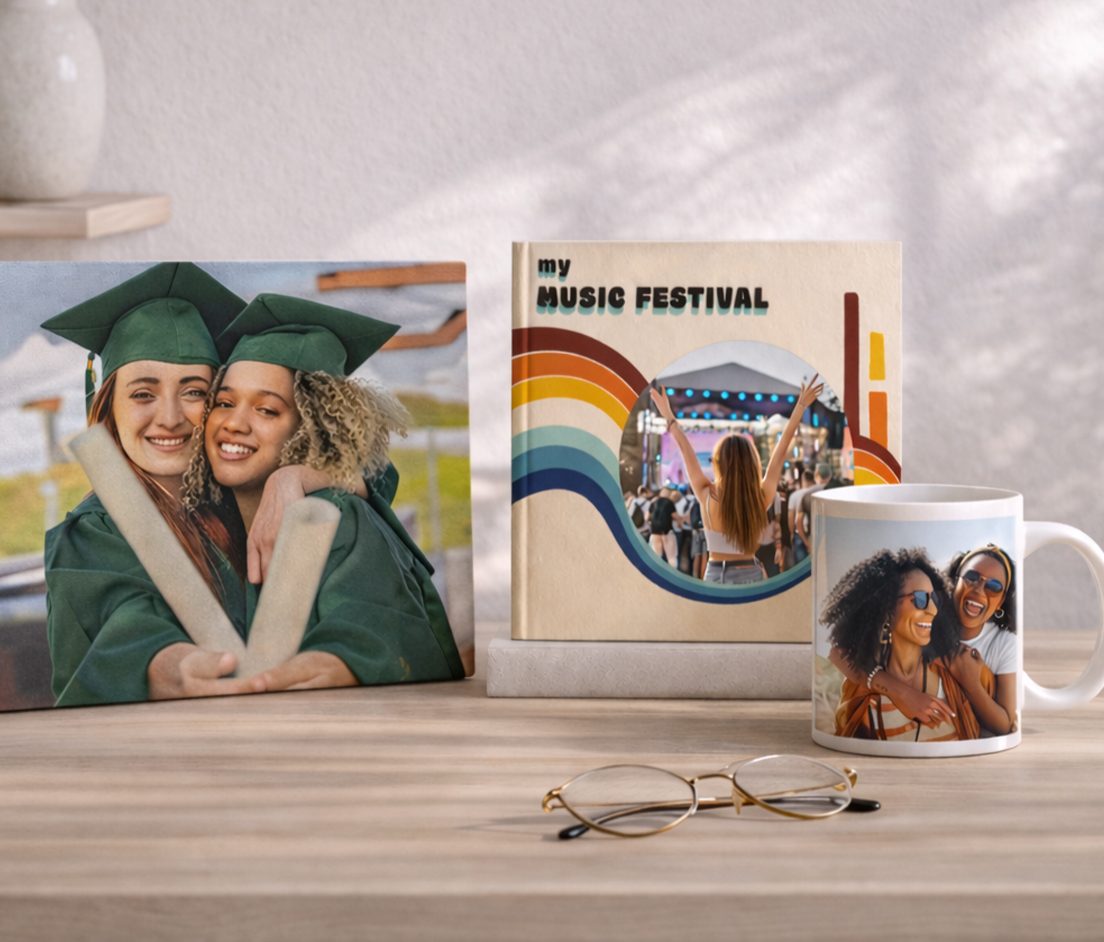 Special Monthly Drops! A bright, lifestyle product display showcasing personalized photo gifts on a wooden surface, including a custom photo canvas, photo book, and printed mug, styled with minimal decor and soft natural lighting to highlight the products.