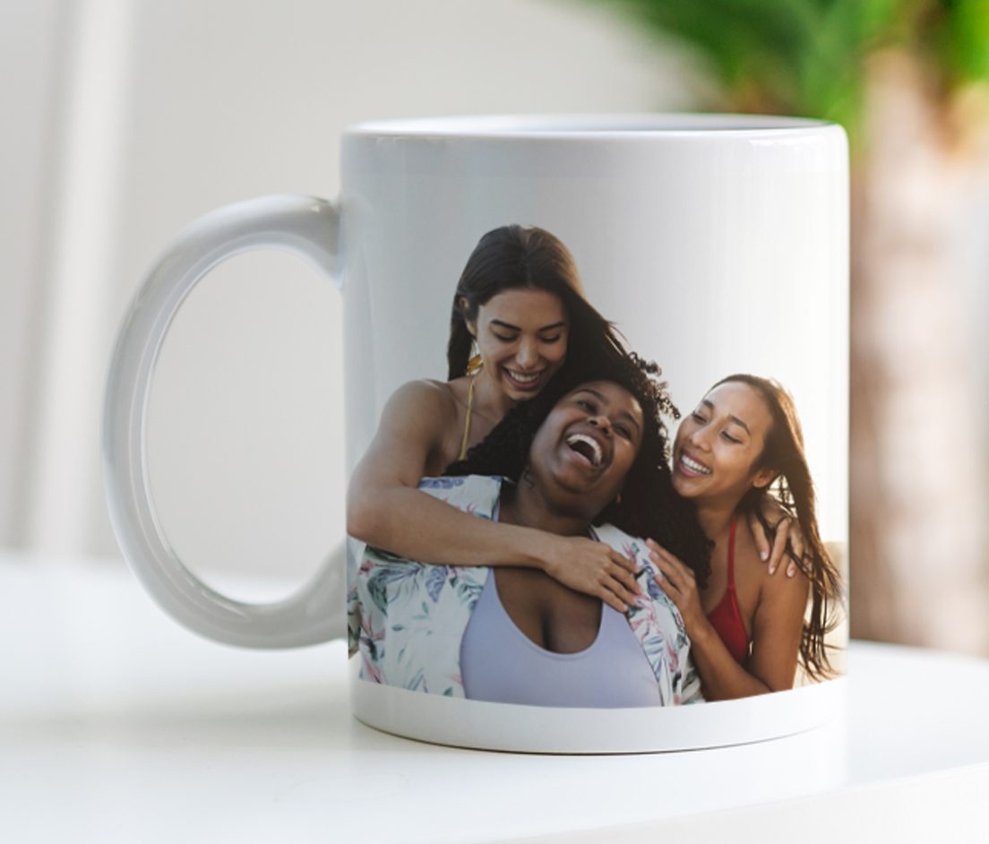 Photo Gifts Canvas print of couple hugging with a surfbaord, a white mug with 'World's Best Dog' text and a picture of a person with a dog, half of a photobook of two women hugging