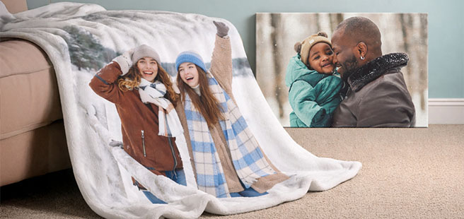 Open layflat photobook showing a photo of a couple on a mountain that stretches across the entire book.
