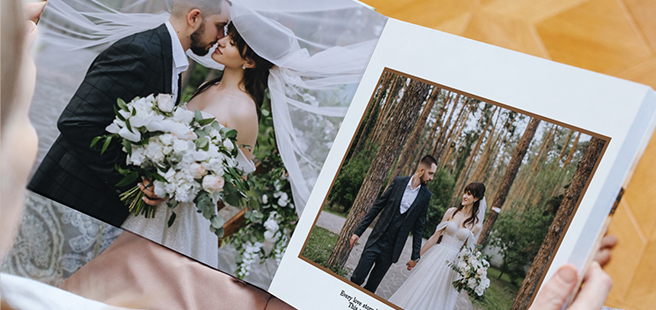 Closed photobook showing photos of a son and father on the cover that reads 'my dad is my superhero'.