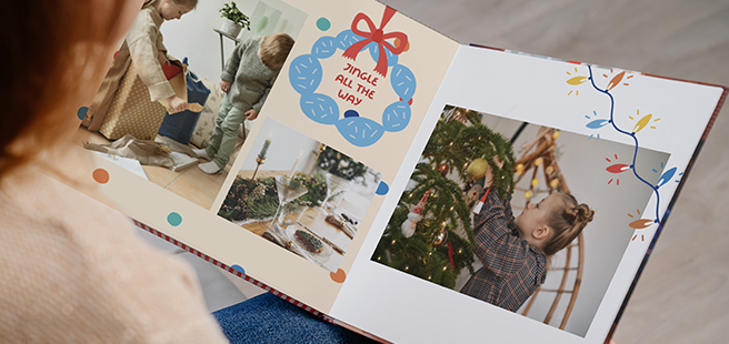 Open layflat photobook showing a photo of a couple on a mountain that stretches across the entire book.