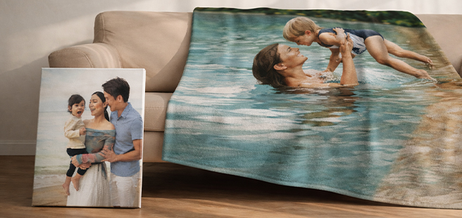 Open layflat photobook showing a photo of a couple on a mountain that stretches across the entire book.