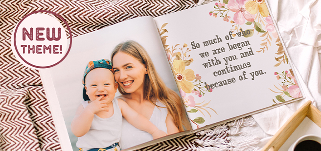 Woman holding an open photobook showing photos of friends celebrating the 4th of July.