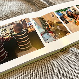Photobook with a young child on the cover with the text 'Our Little Wild One Turns One'